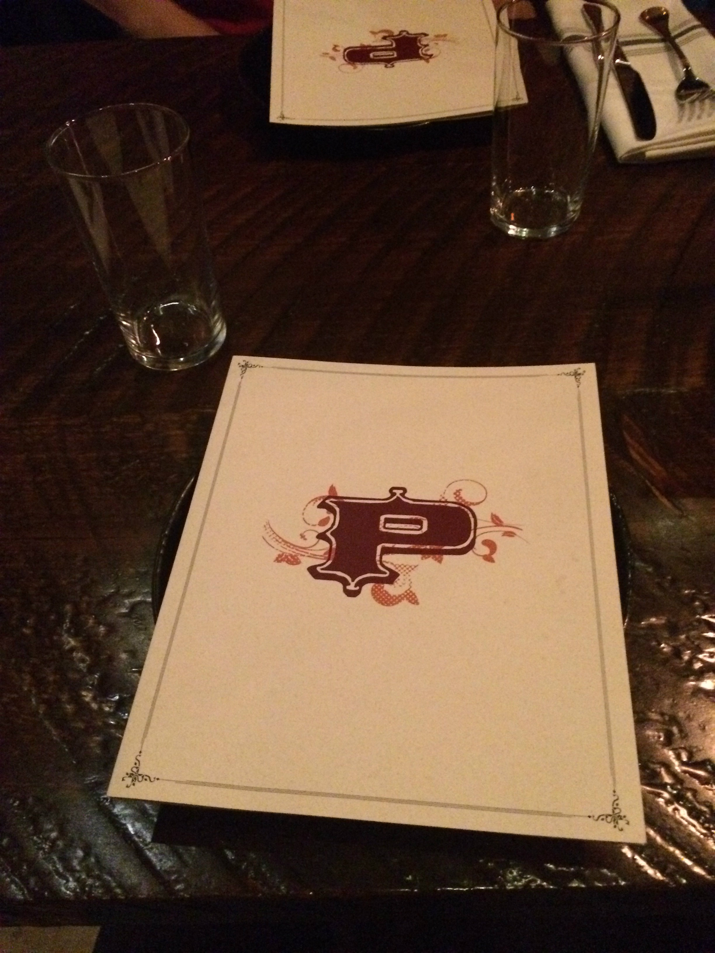 A table with a fancy paper menu