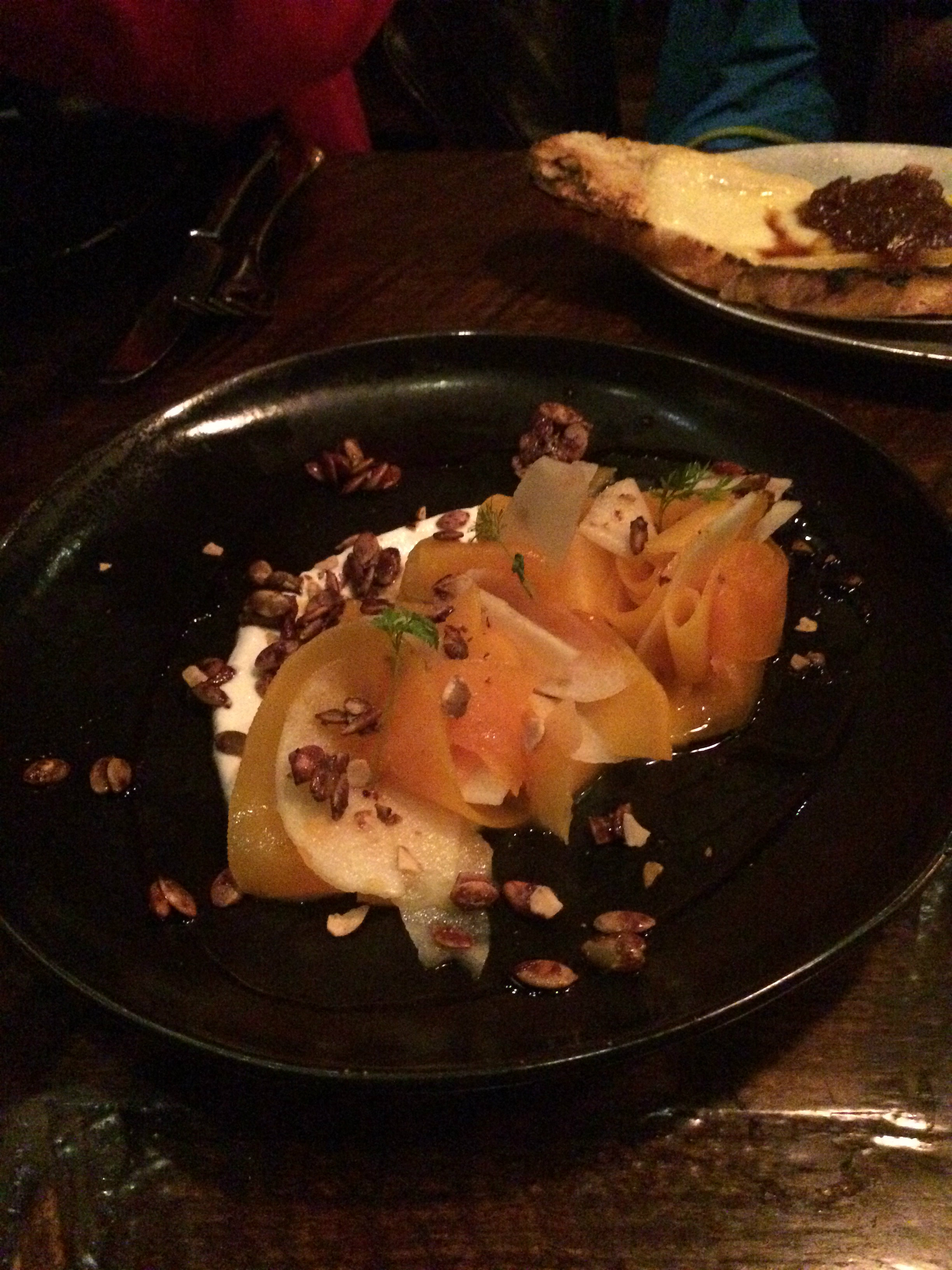 Thick ribbons of picked pumpkin, curved elegantly on the plate