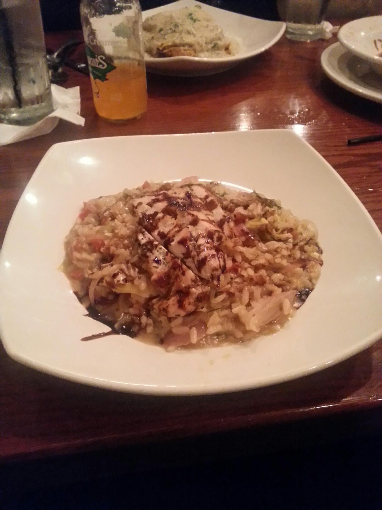 Risotto with roasted chicken, drizzled with balsamic vinegar