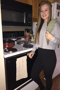 image: Rhiannon next to her oven.