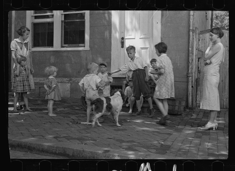 Children playing on a sidewalk