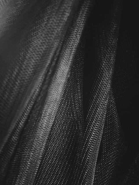 Image of a folded black mesh.